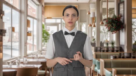 Indian-woman-waiter-talking-to-the-customer