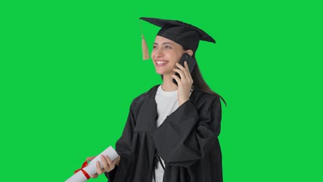 Happy-Indian-college-graduate-girl-talking-to-parents-through-call-Green-screen