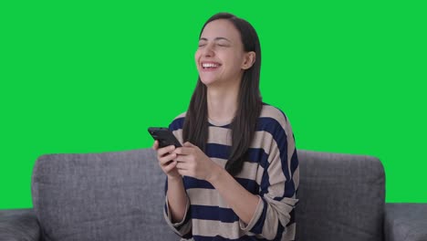 Happy-Indian-girl-chatting-with-someone-Green-screen