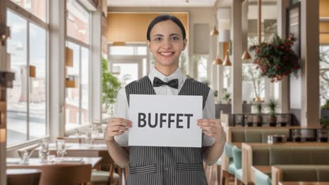 Happy-Indian-woman-waiter-holding-BUFFET-banner