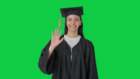 Happy-Indian-college-graduate-girl-waving-Hi-to-the-camera-Green-screen