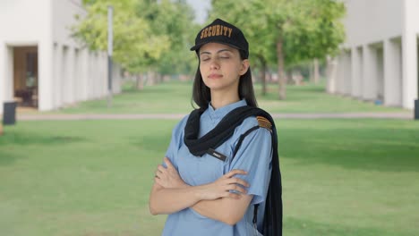 Portrait-of-Indian-female-security-guard-standing-crossed-hands