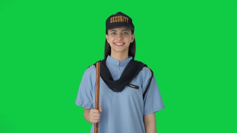 Happy-Indian-female-security-guard-smiling-Green-screen