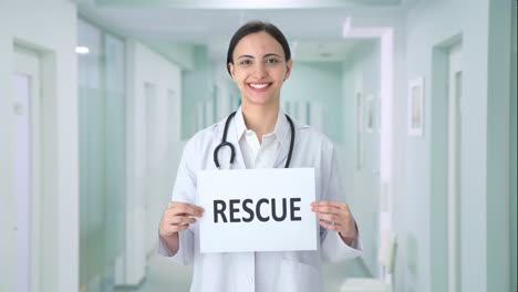 Happy-Indian-female-doctor-holding-RESCUE-banner