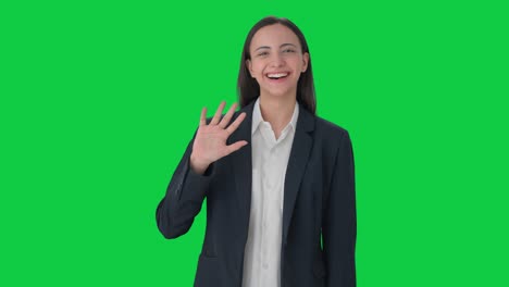 Happy-Indian-business-woman-waving-Hi-to-the-camera-Green-screen