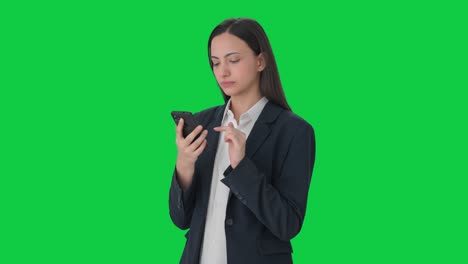 Indian-business-woman-using-mobile-phone-Green-screen