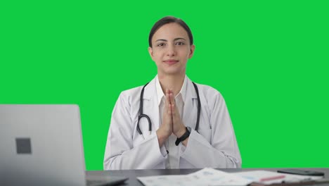 Happy-Indian-female-doctor-doing-Namaste-Green-screen