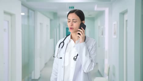 Indian-female-doctor-explaining-medical-reports-to-patient-on-call