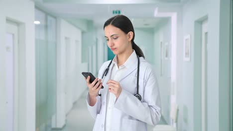 Indian-female-doctor-using-phone