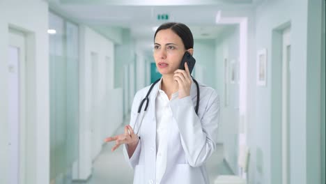 Indian-female-doctor-talking-on-call