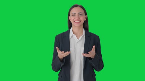 Happy-Indian-female-manager-talking-to-the-camera-Green-screen