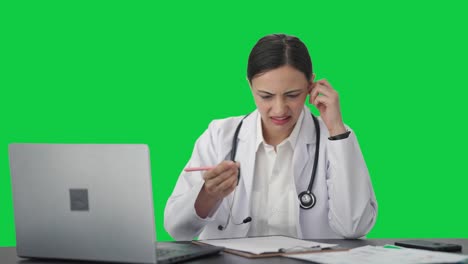 Confused-Indian-female-doctor-student-studying-for-exams-Green-screen