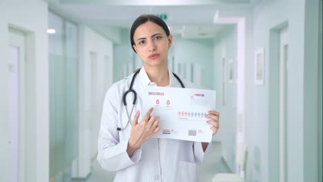 Indian-female-doctor-explaining-medical-reports-to-patient