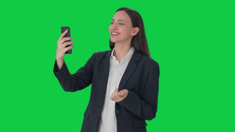 Happy-Indian-female-manager-talking-on-video-call-Green-screen
