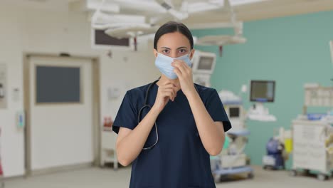 Indian-female-doctor-putting-mask-on