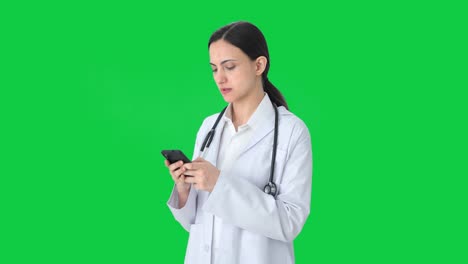 Angry-Indian-female-doctor-chatting-with-someone-Green-screen