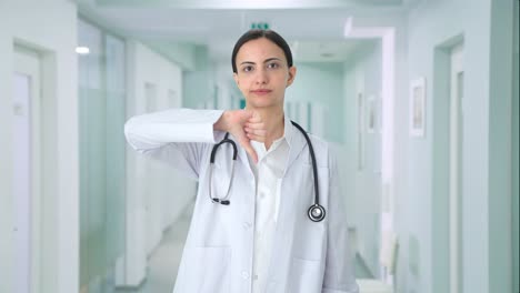 Upset-Indian-female-doctor-showing-thumbs-down