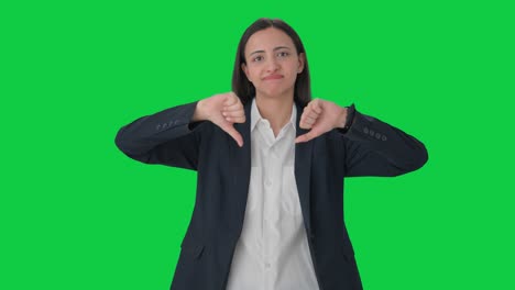 Upset-Indian-female-manager-showing-thumbs-down-Green-screen