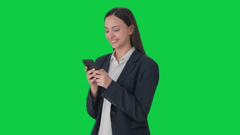 Happy-Indian-female-manager-chatting-with-someone-Green-screen