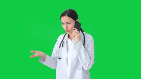 Angry-Indian-female-doctor-shouting-on-phone-Green-screen