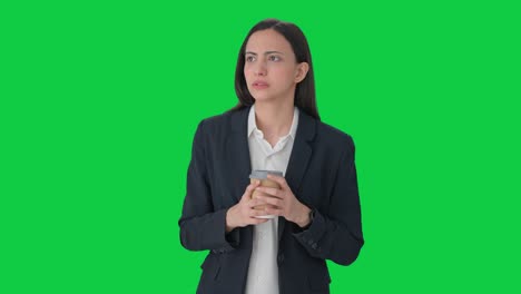 Worried-Indian-female-manager-waiting-for-someone-Green-screen