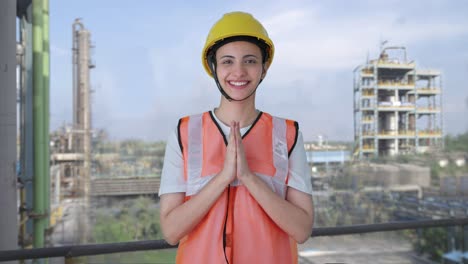 Happy-Indian-female-construction-worker-doing-Namaste