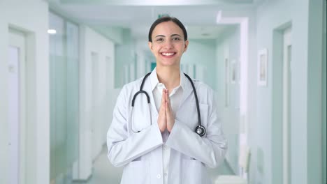 Happy-Indian-female-doctor-doing-Namaste
