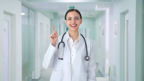 Happy-Indian-female-doctor-talking-to-the-camera