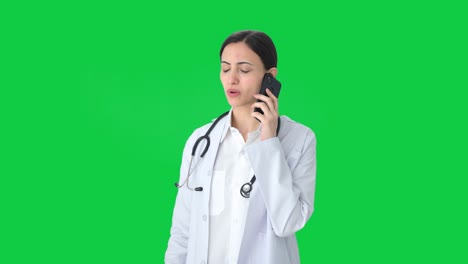 Indian-female-doctor-explaining-medical-reports-to-patient-on-call-Green-screen