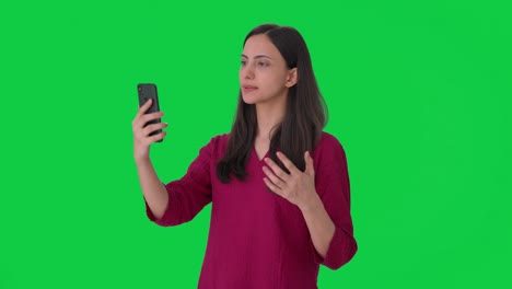 Indian-woman-talking-on-video-call-Green-screen