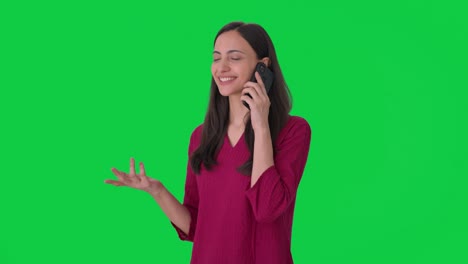 Happy-Indian-woman-talking-to-someone-on-call-Green-screen