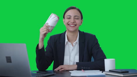 Happy-Indian-business-woman-using-money-as-fan-Green-screen