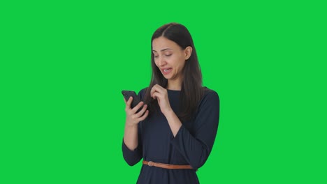 Tired-and-lazy-Indian-girl-using-phone-Green-screen
