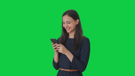 Happy-Indian-girl-chatting-with-someone-Green-screen