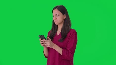 Angry-Indian-woman-chatting-with-someone-Green-screen