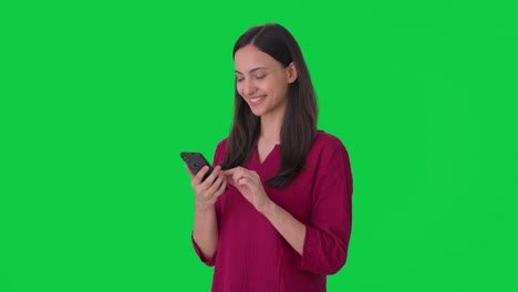 Happy-Indian-woman-using-phone-Green-screen