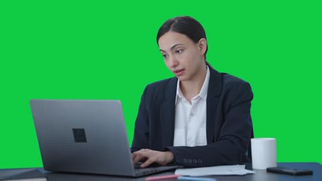 Tired-Indian-female-manager-sleeping-at-work-Green-screen