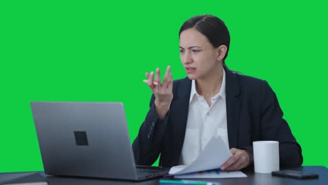 Stressed-Indian-female-manager-working-on-laptop-Green-screen