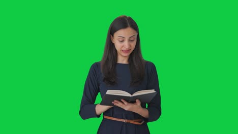 Tired-Indian-girl-reading-a-book-Green-screen