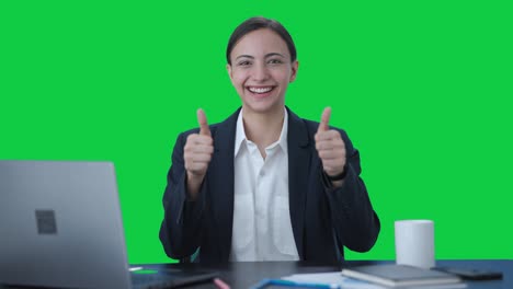 Happy-Indian-business-woman-doing-thumbs-up-Green-screen