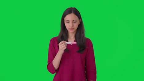Happy-Indian-woman-checking-pregnancy-test-Green-screen