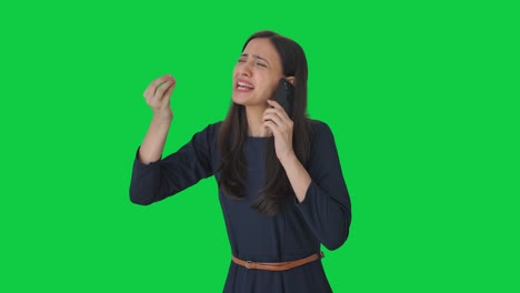 Angry-Indian-girl-shouting-on-someone-on-call-Green-screen
