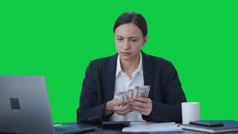 Sad-Indian-business-woman-loses-money-Green-screen