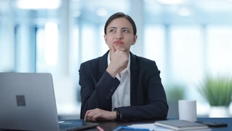 Confused-Indian-female-manager-thinking-about-something