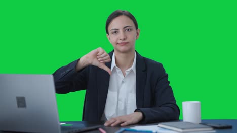 Upset-Indian-business-woman-showing-thumbs-down-Green-screen