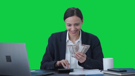 Happy-Indian-business-woman-counting-money-Green-screen