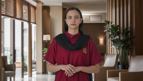 Indian-female-housekeeper-looking-at-the-camera
