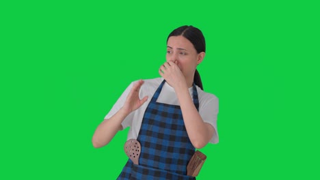 Sad-Indian-housewife-disgusted-by-bad-smell-Green-screen