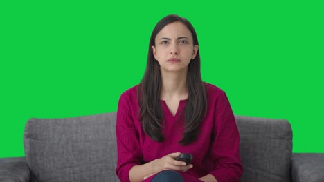Sad-Indian-woman-watching-TV-Green-screen