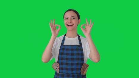 Happy-Indian-housewife-showing-okay-sign-Green-screen